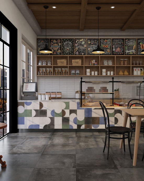 Arcadia Blend café interior featuring Blend Series Graphite floor tiles, Geo Art counter tiles, and Minimalist Muse Wavy Cascade wall tiles.