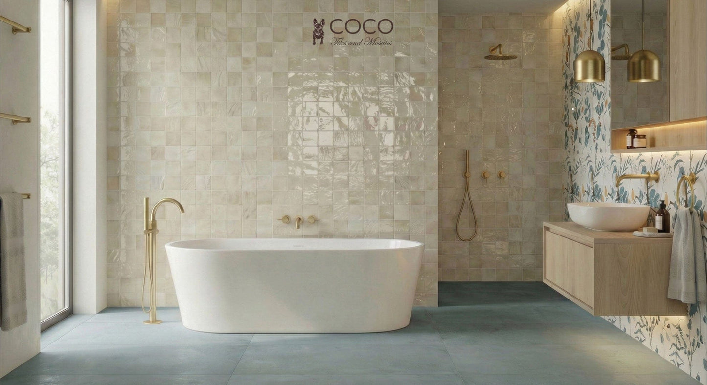 Modern vintage bathroom tile look with Ocean Mist concrete effect matte 600x1200 porcelain floor tiles, Between Sand gloss 400x800 wall tiles behind bath and shower, and Songbirds feature wall tile behind the vanity.