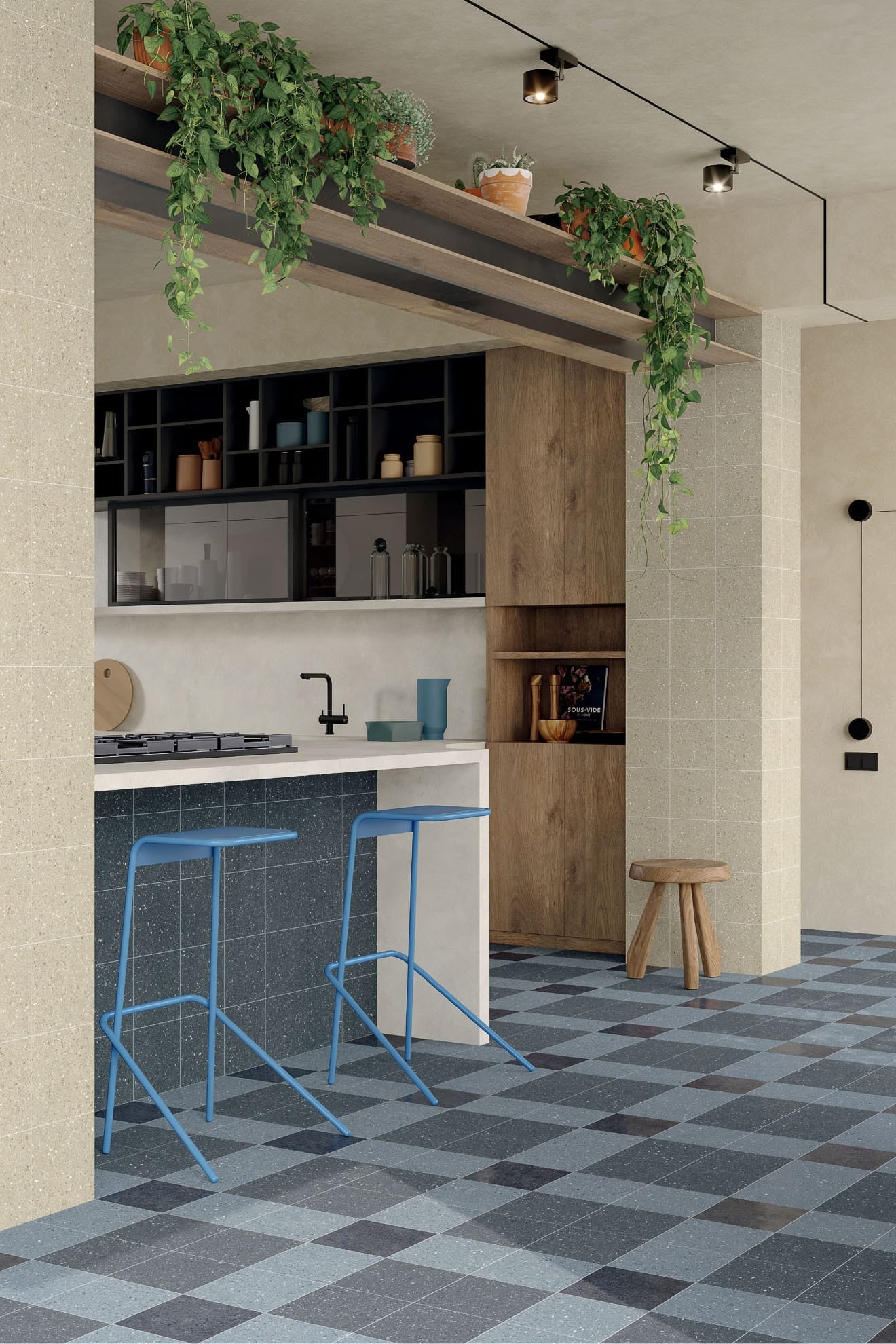 Modern kitchen featuring the Blue Beat tile look with a blue and grey checkerboard floor using Vogue Sorgente and deep blue-grey Blu Lacca porcelain tiles, paired with warm beige Vogue Sabbia wall tiles and a Laguna blue-grey front counter bench.