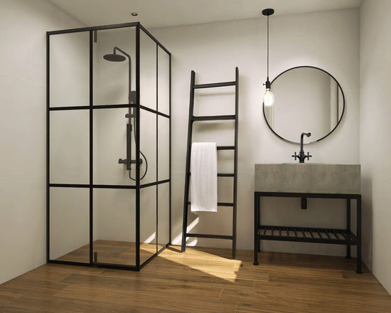 The Urbanist bathroom look with Grandeur Autumn Arbour brown timber-look porcelain floor tiles and Smooth Dreams Perfect Day white satin ceramic wall tiles. Black metal and concrete vanity. For sale at COCO Tiles and Mosaics.