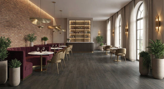 Luxury lounge interior featuring COCO Tiles & Mosaics Grandeur Touch Series Midnight Oak Matt 200x1200mm
porcelain timber-look floor tiles, brick walls, and plum velvet seating.